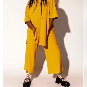 Dressed in LALA Lex Ribbed Playsuit in Golden Yellow